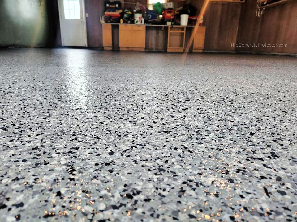 Gray flake epoxy coating on a residential garage floor