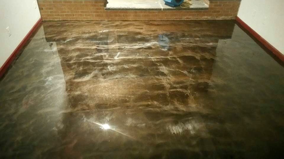 Metallic epoxy floor with blue and teal swirls